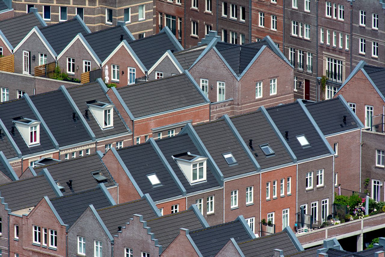 Aerial view of traditional Dutch townhouses in Den Haag, showcasing unique architecture.